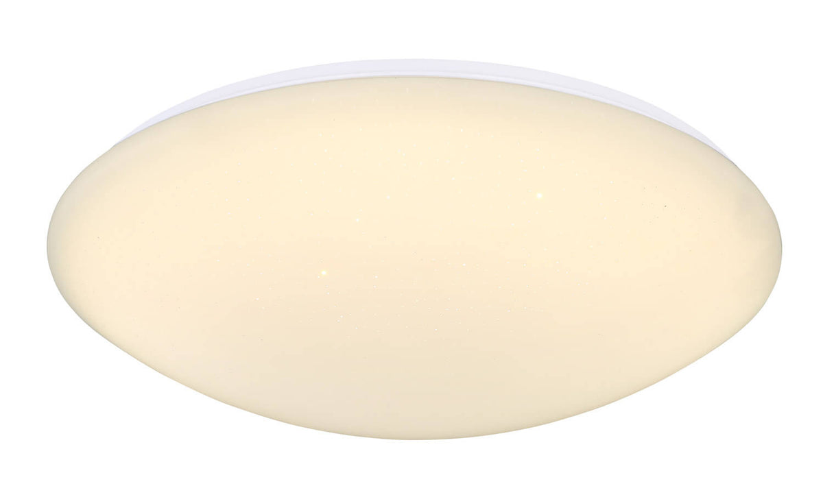 Gros plan du luminaire rond allumé, verre opalin blanc chaud