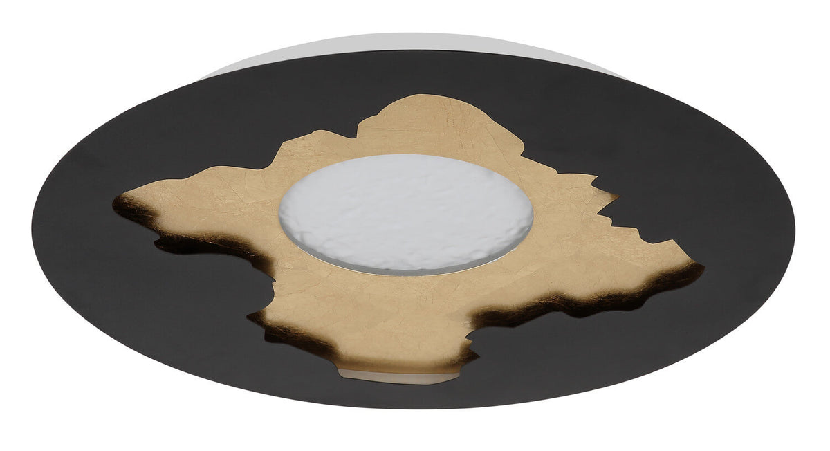 Détail de la découpe dorée en forme de feuille sur le disque noir mat