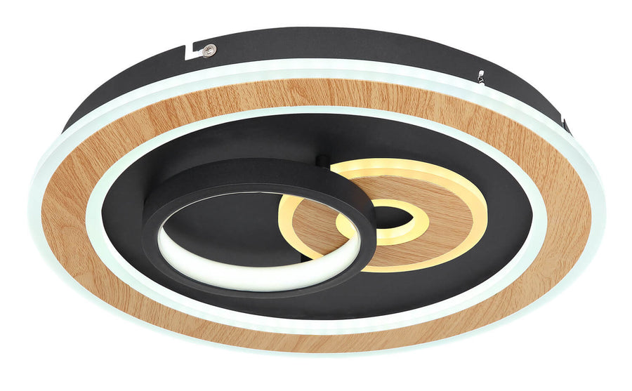 Photo du luminaire allumé en blanc froid avec cercles en bois et métal noir.