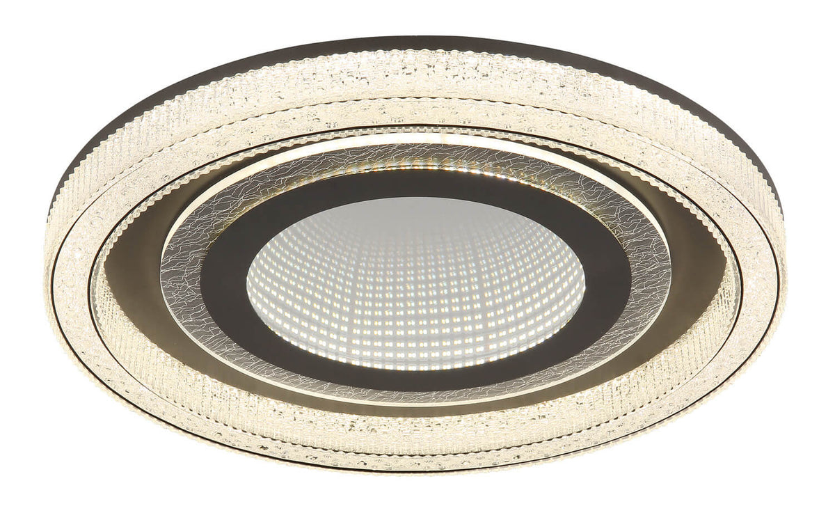 Vue rapprochée du plafonnier avec bordure en verre et LED centrale allumée.
