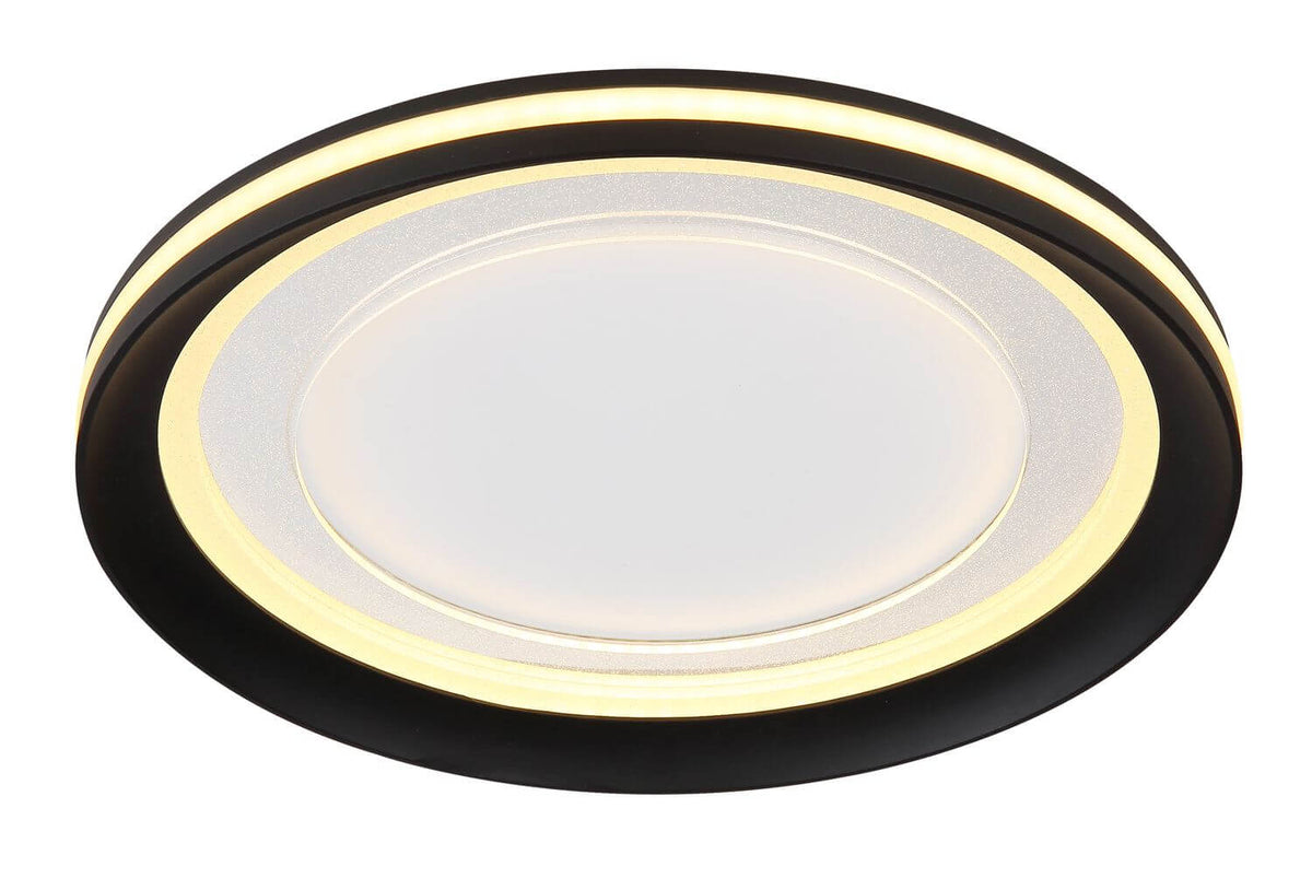 Vue rapprochée du diffuseur central strié et du cerclage lumineux doré du plafonnier