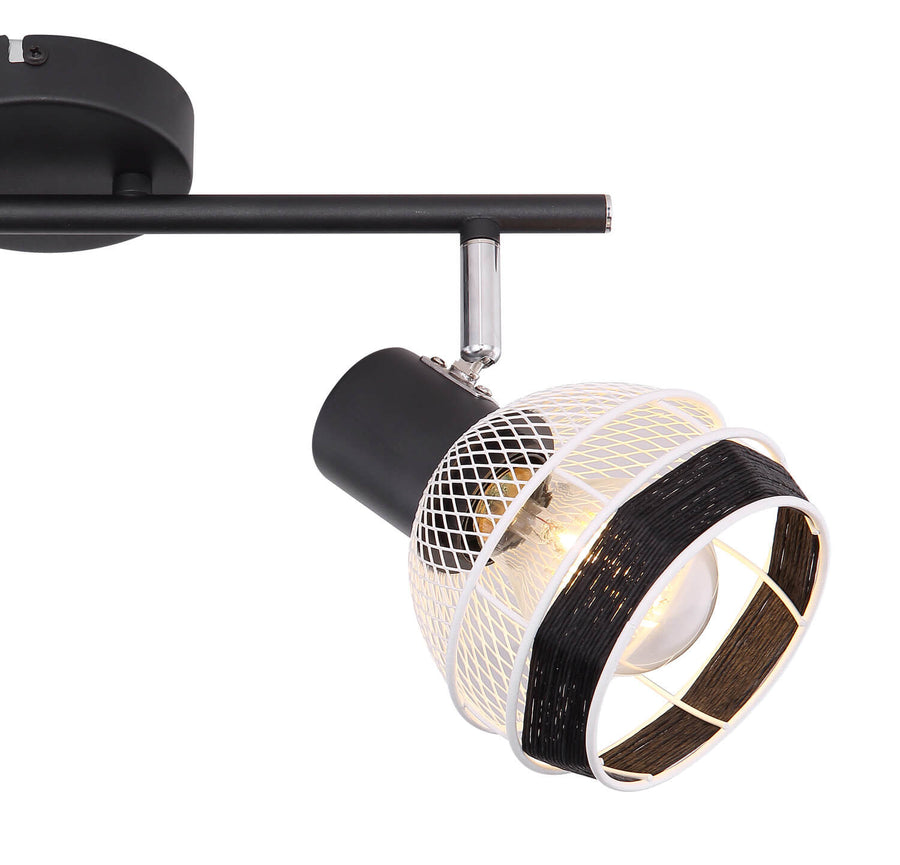 Gros plan sur une tête orientable, grille blanche, bande noire et ampoule allumée.