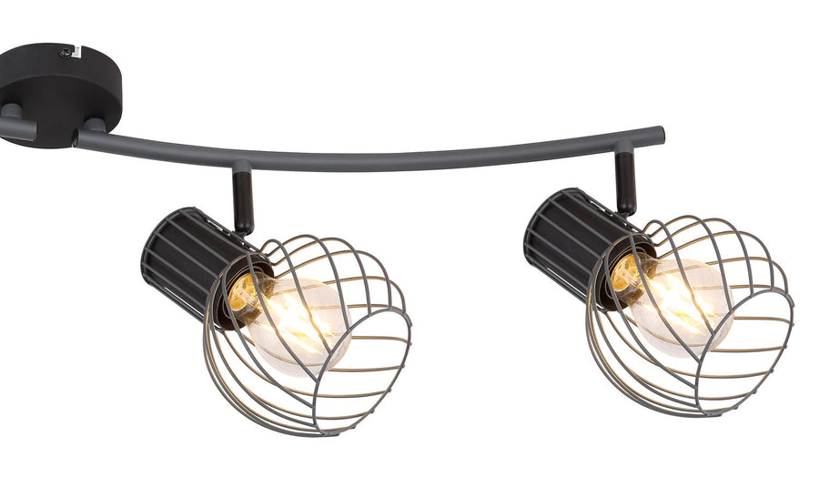 Détail de deux spots orientables fixés sur le rail, cages grillagées visibles