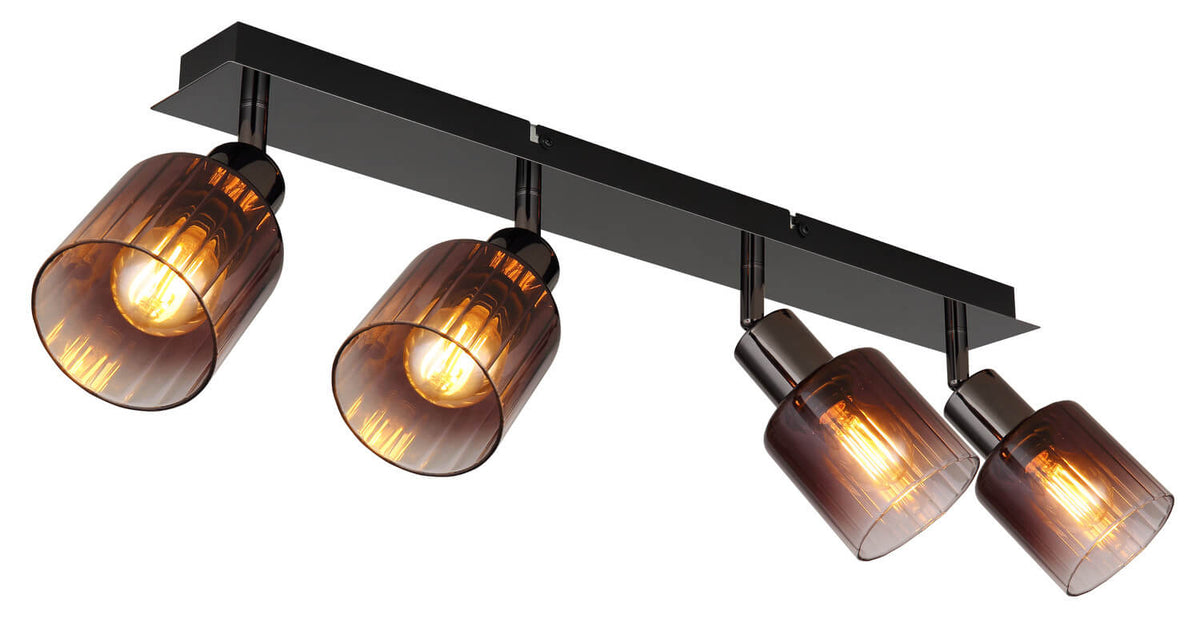 Vue rapprochée du spot Satella noir et chromé, quatre têtes cylindriques et ampoules visibles