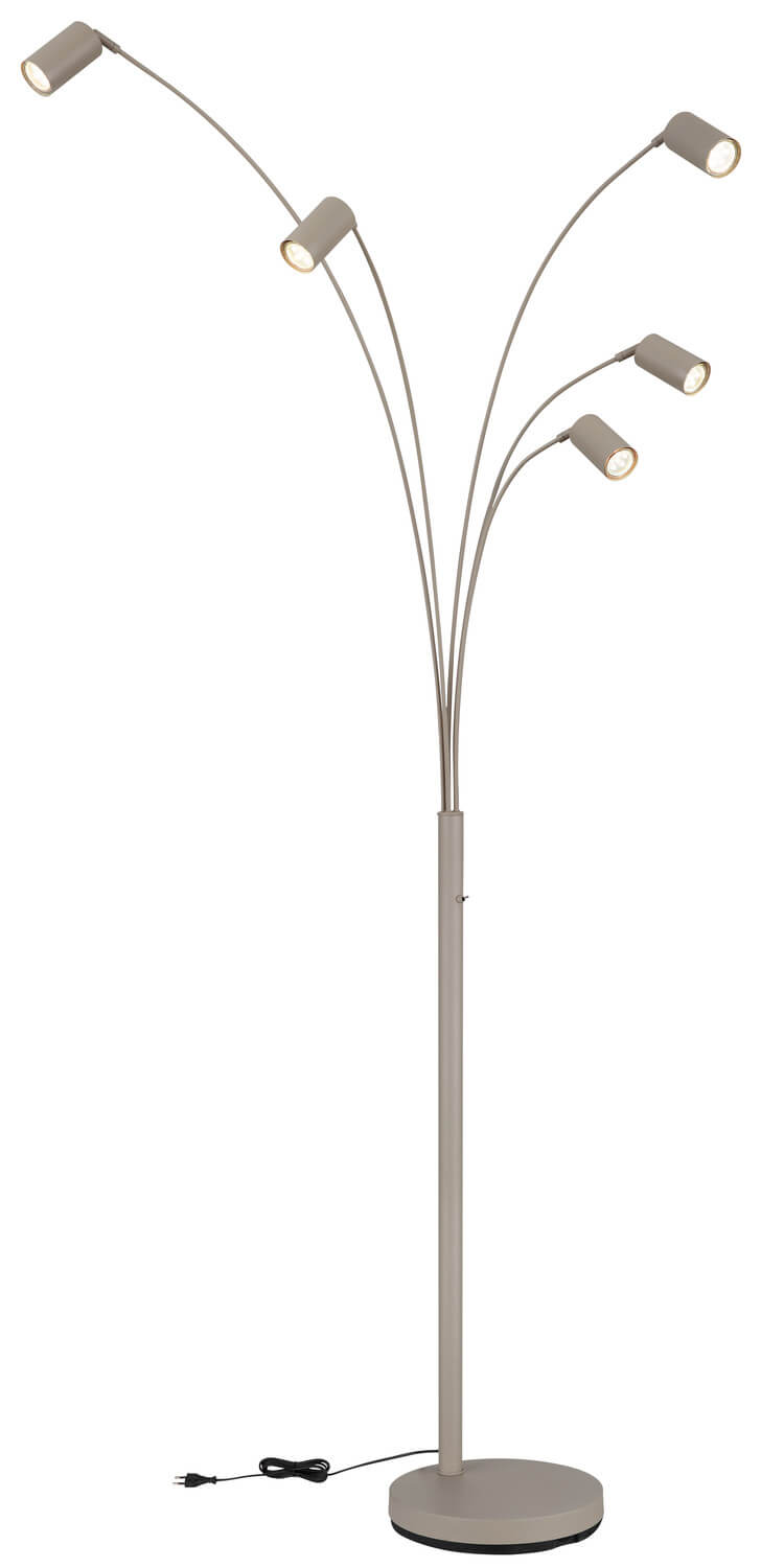 Détail du socle rond posé au sol avec le câble d'alimentation