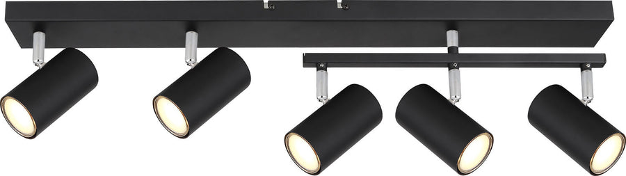 Détail du rail noir et des projecteurs cylindriques orientables fixés au plafond