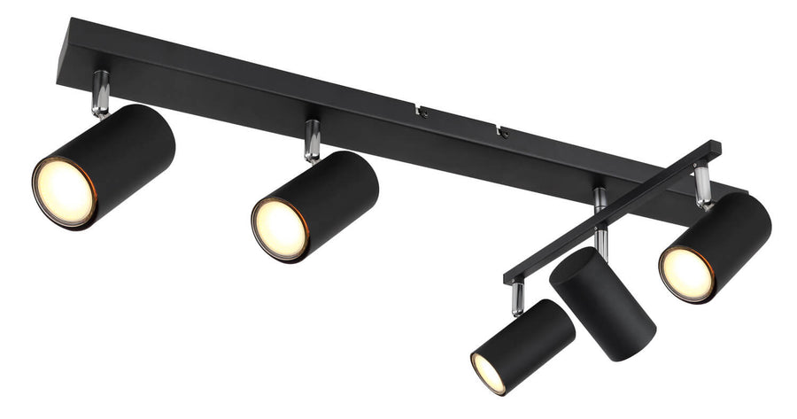 Autre angle du luminaire noir montrant les cinq spots cylindriques et le rail