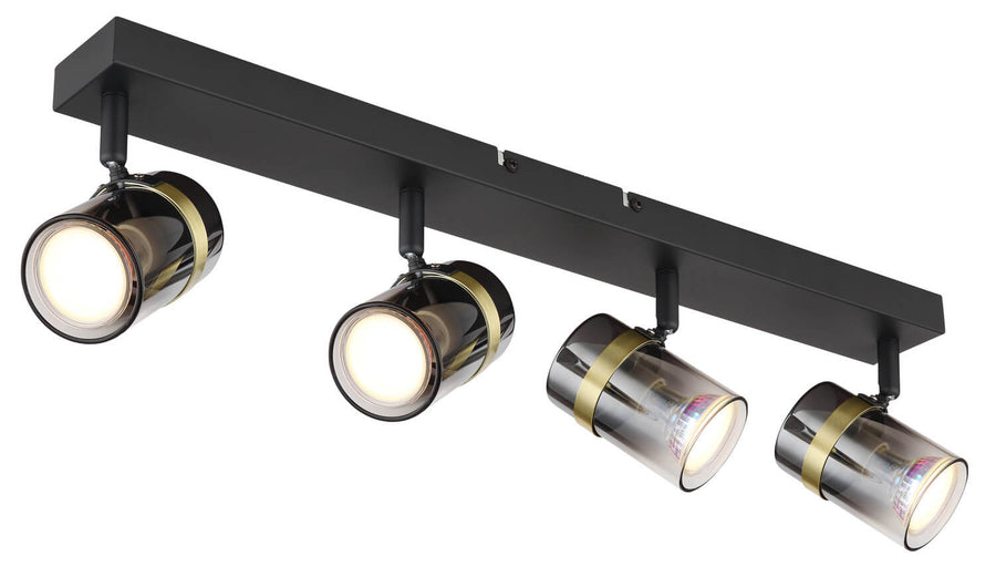 Vue en perspective du luminaire, quatre spots cylindriques inclinés sur rail rectangulaire.