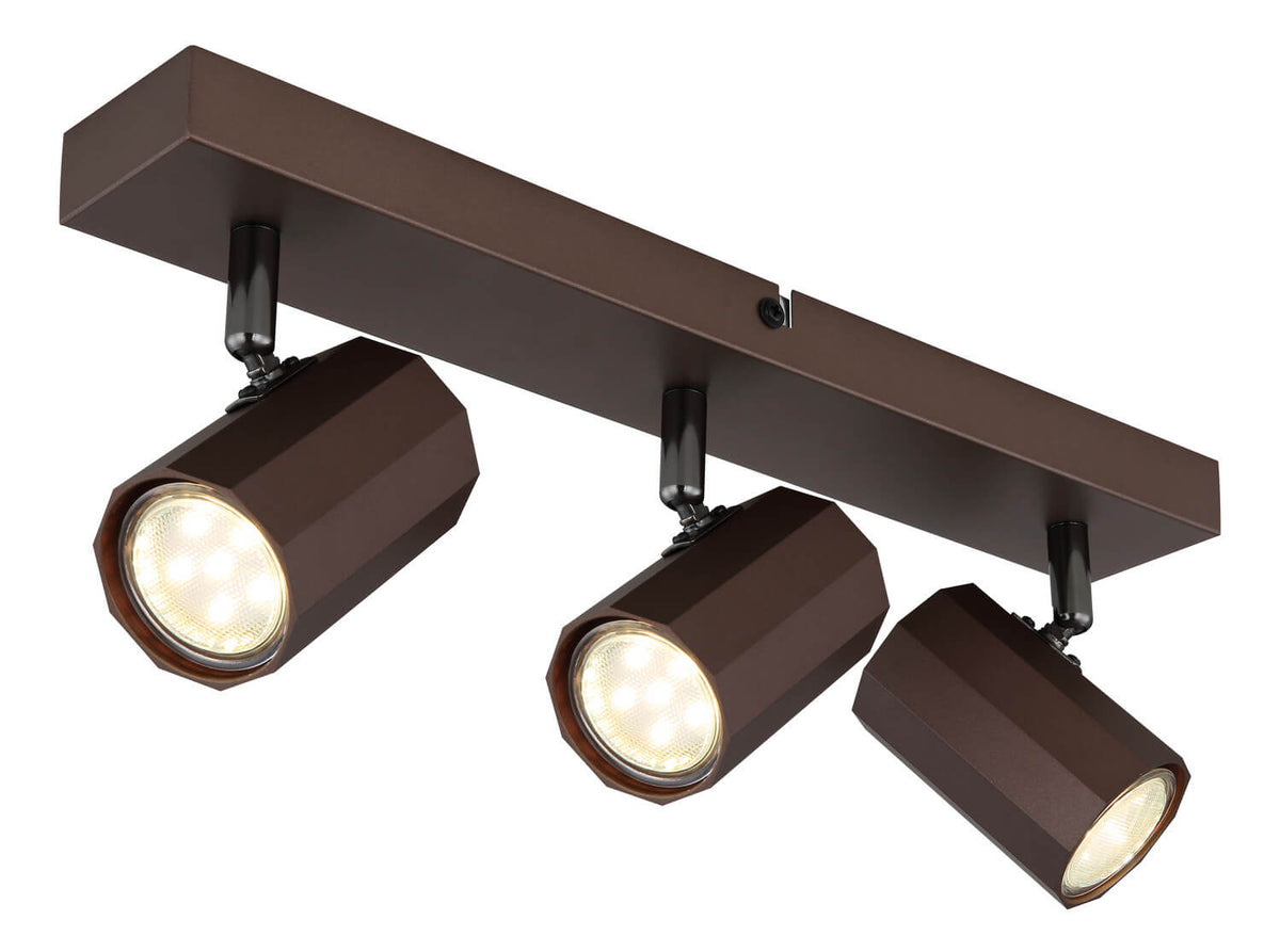 Autre angle du luminaire plafond, projecteurs cylindriques bronze éclairés et détails des fixations