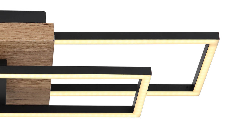 Détail rapproché de la finition bois et du bandeau LED éclairé du plafonnier.
