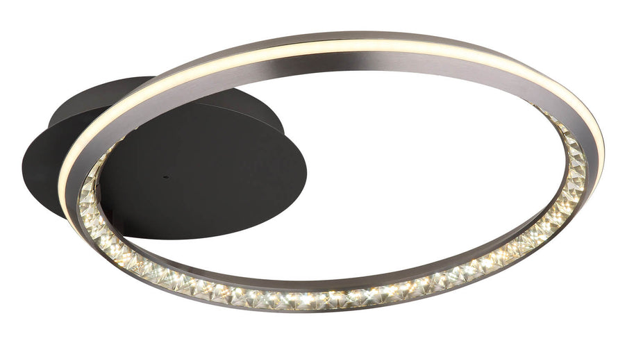 Second angle du luminaire rond, anneau métallique et diffuseur LED allumé.