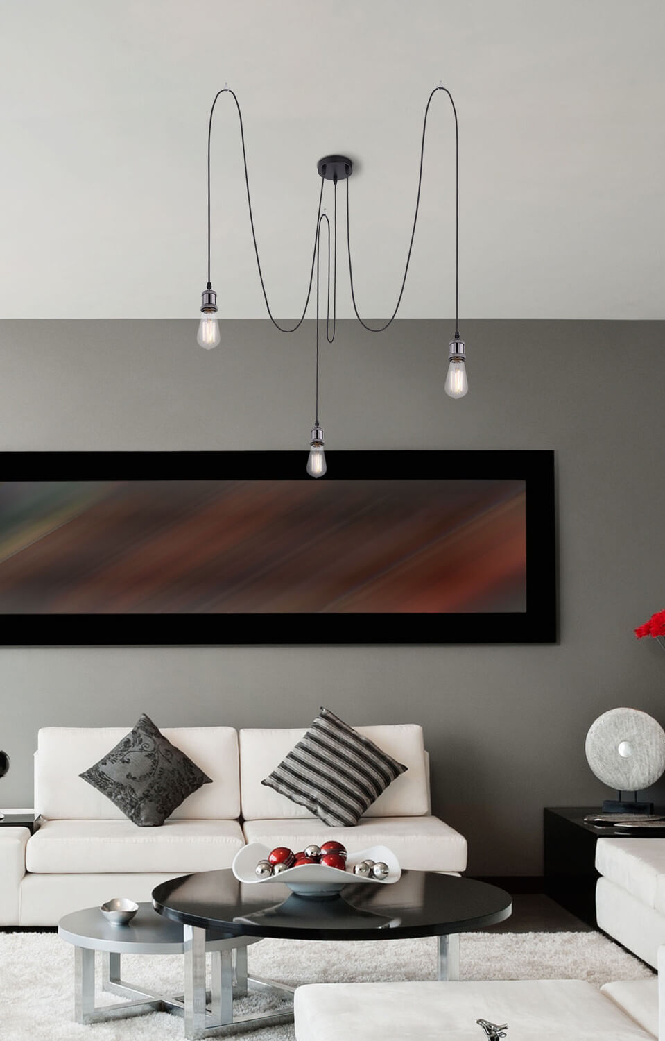 Mise en ambiance dans un salon moderne, suspension noire au-dessus d'une table basse