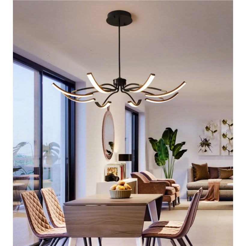 Mise en ambiance du luminaire suspendu au-dessus d'une table dans un séjour lumineux.