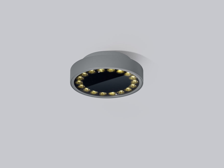 Vue de trois quarts du plafonnier rond anthracite avec couronne de LED allumée.