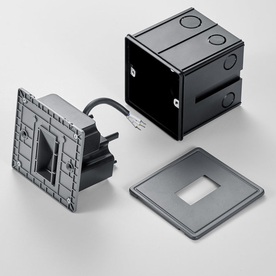 Vue éclatée du luminaire : façade, boîtier d'encastrement, plaque de finition et câblage