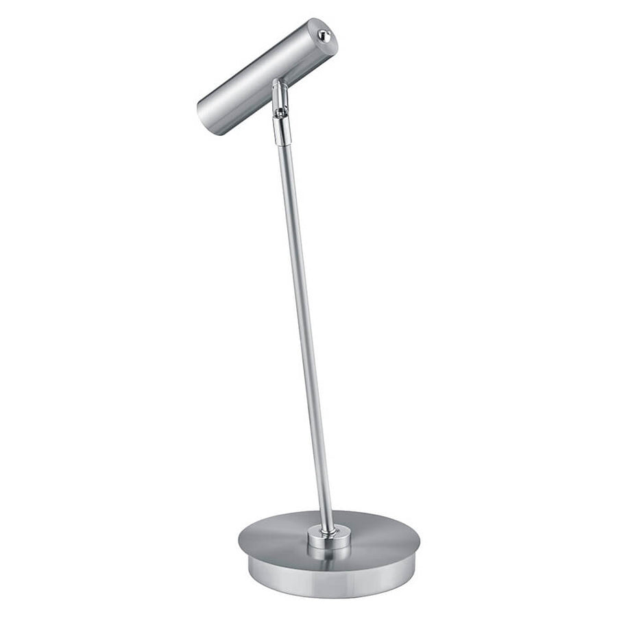 Vue de trois quarts du luminaire, tête inclinée et base ronde visibles.