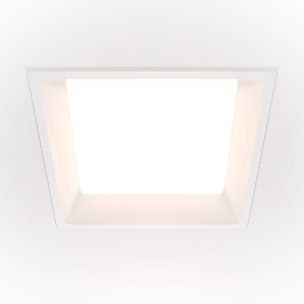 Vue de face du spot encastré blanc au design carré et minimaliste.