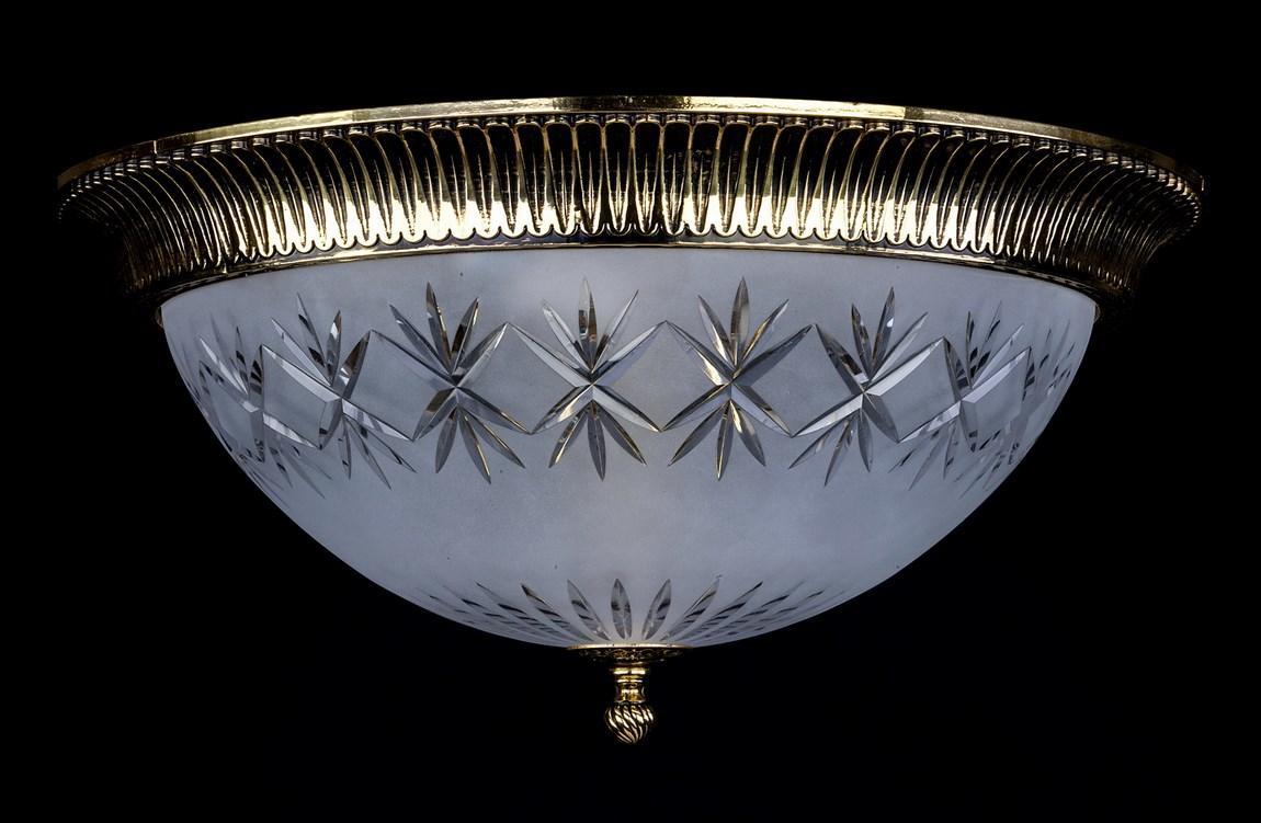 Plafonnier doré de face, coupe en verre dépoli ornée d'étoiles taillées