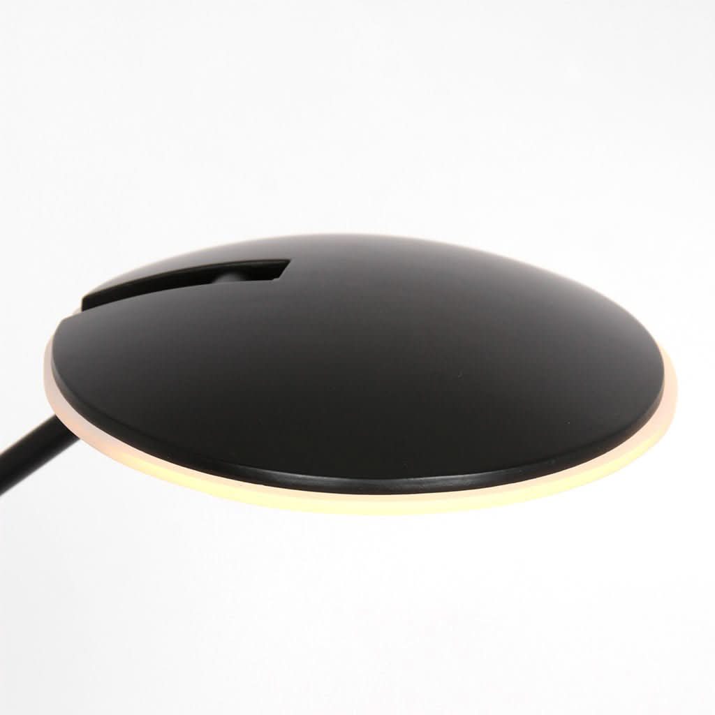 Détail de la tête plate noire et de l'anneau lumineux LED.
