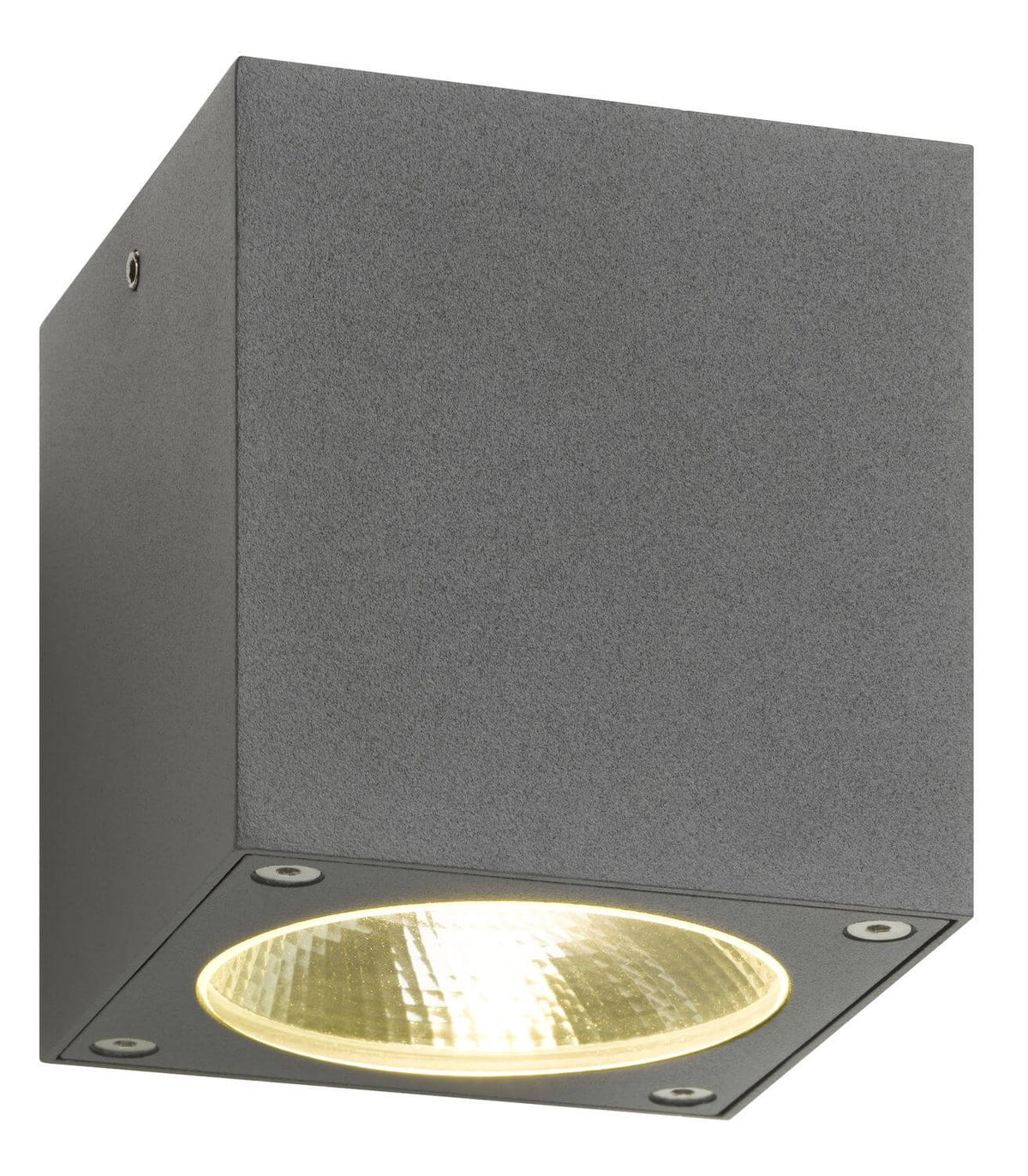 Vue de dessous du luminaire allumé, halo doré diffusé par la lentille circulaire