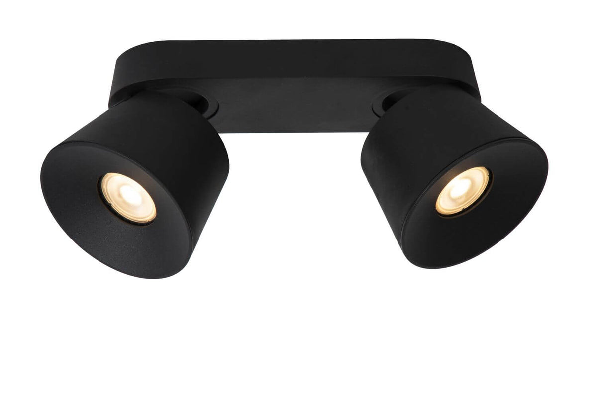 Vue rapprochée en biais du plafonnier noir, montrant les deux têtes orientables éclairées.