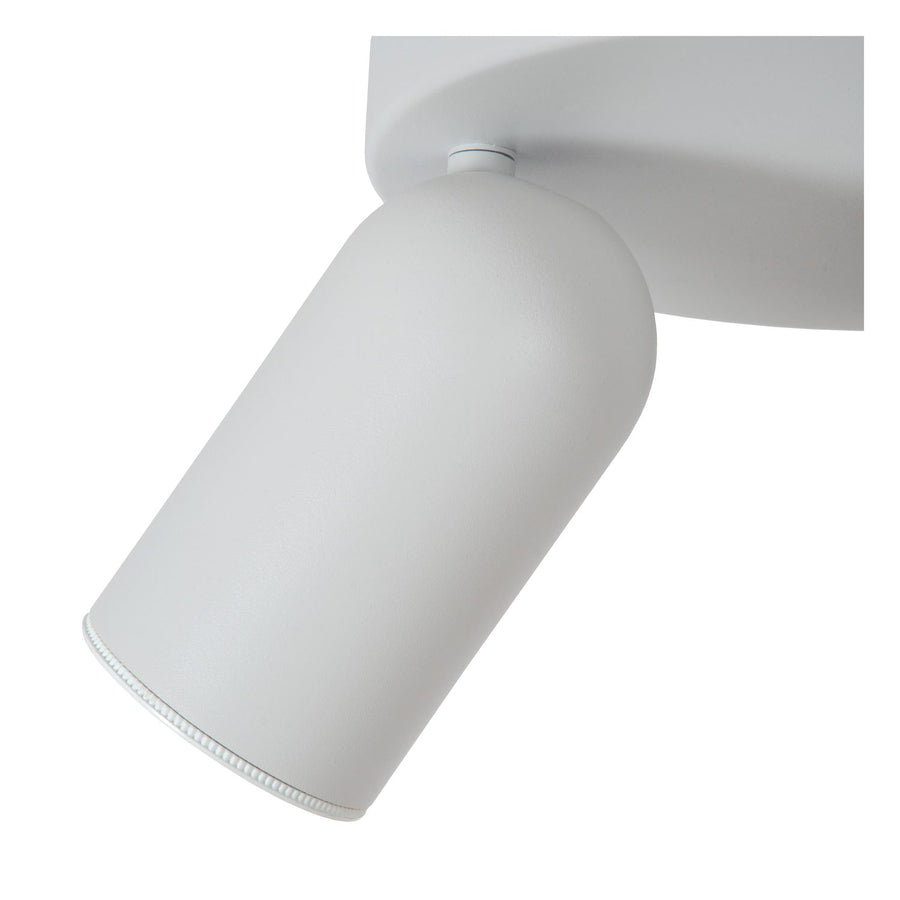 Gros plan sur une tête cylindrique blanche et son axe d'orientation