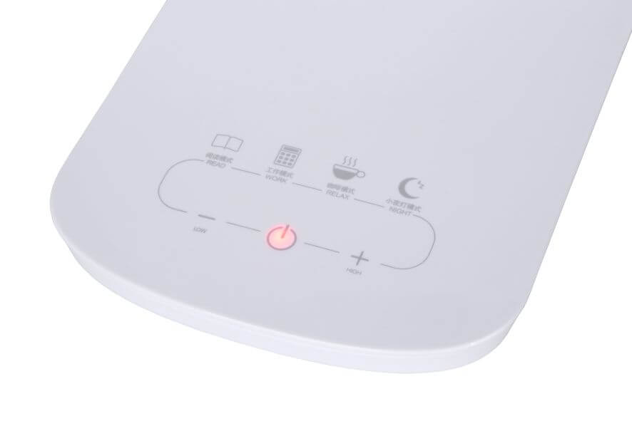 Détail du socle tactile blanc avec icônes de modes lecture, travail, détente et nuit