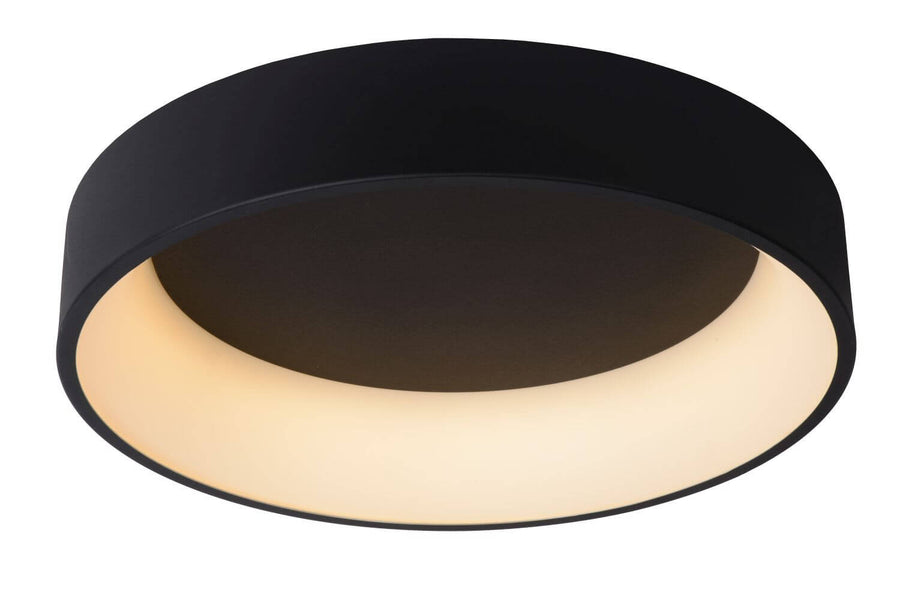 Vue de face du plafonnier rond noir allumé avec diffuseur blanc lumineux