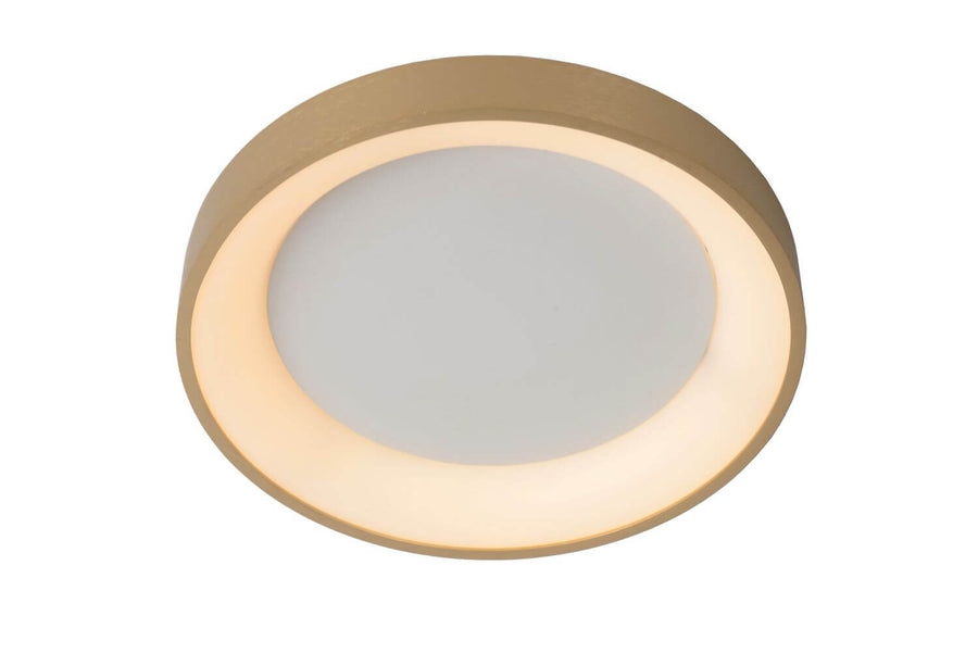 Vue de dessous montrant l'anneau doré et le diffuseur opale lumineux