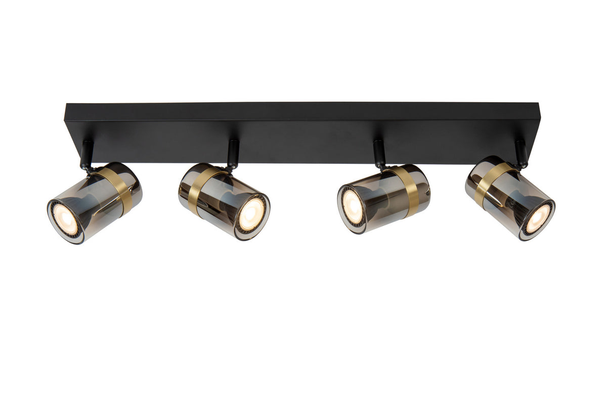 Luminaire quatre spots cylindriques en verre fumé et laiton, fond blanc