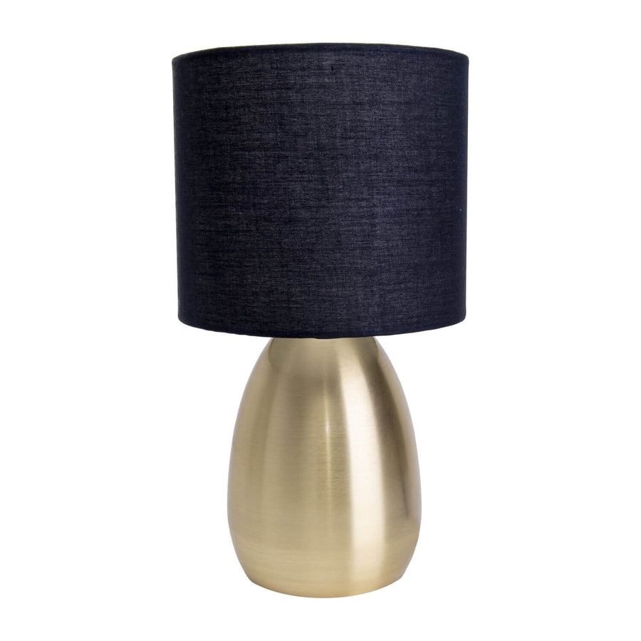Lampe à poser dorée et son abat-jour noir en tissu, vue de face sur fond blanc.