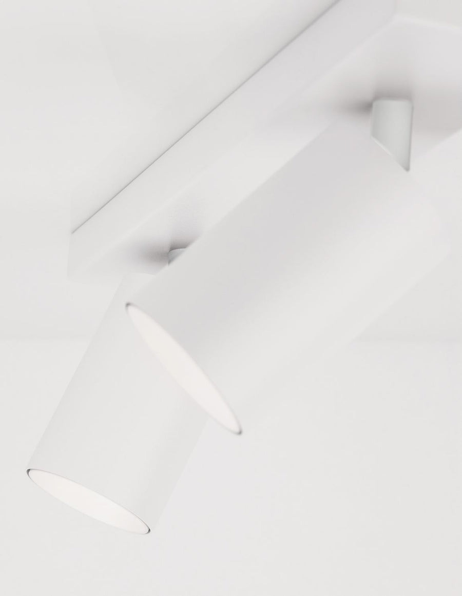 Détail de la finition laquée blanche des deux têtes cylindriques orientables du spot
