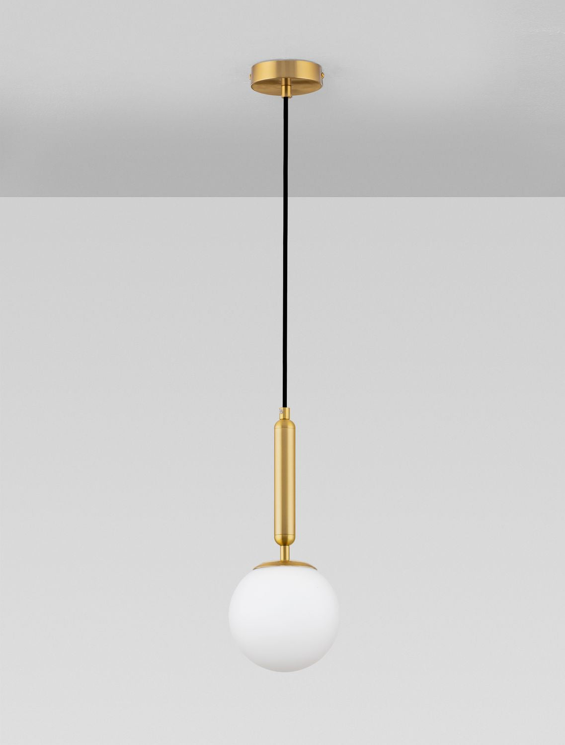 Suspension complète sur fond gris clair, montrant le câble noir et la tige dorée.