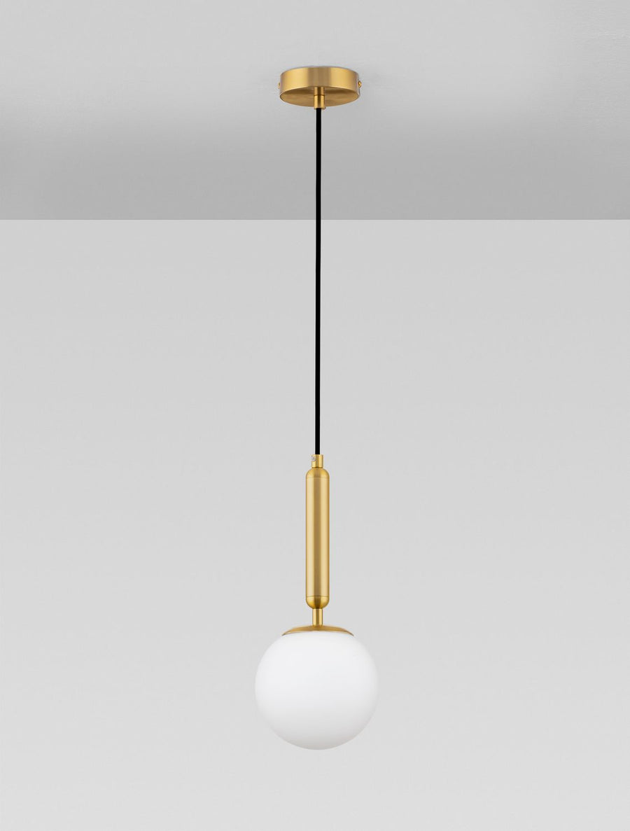 Suspension complète sur fond gris clair, montrant le câble noir et la tige dorée.