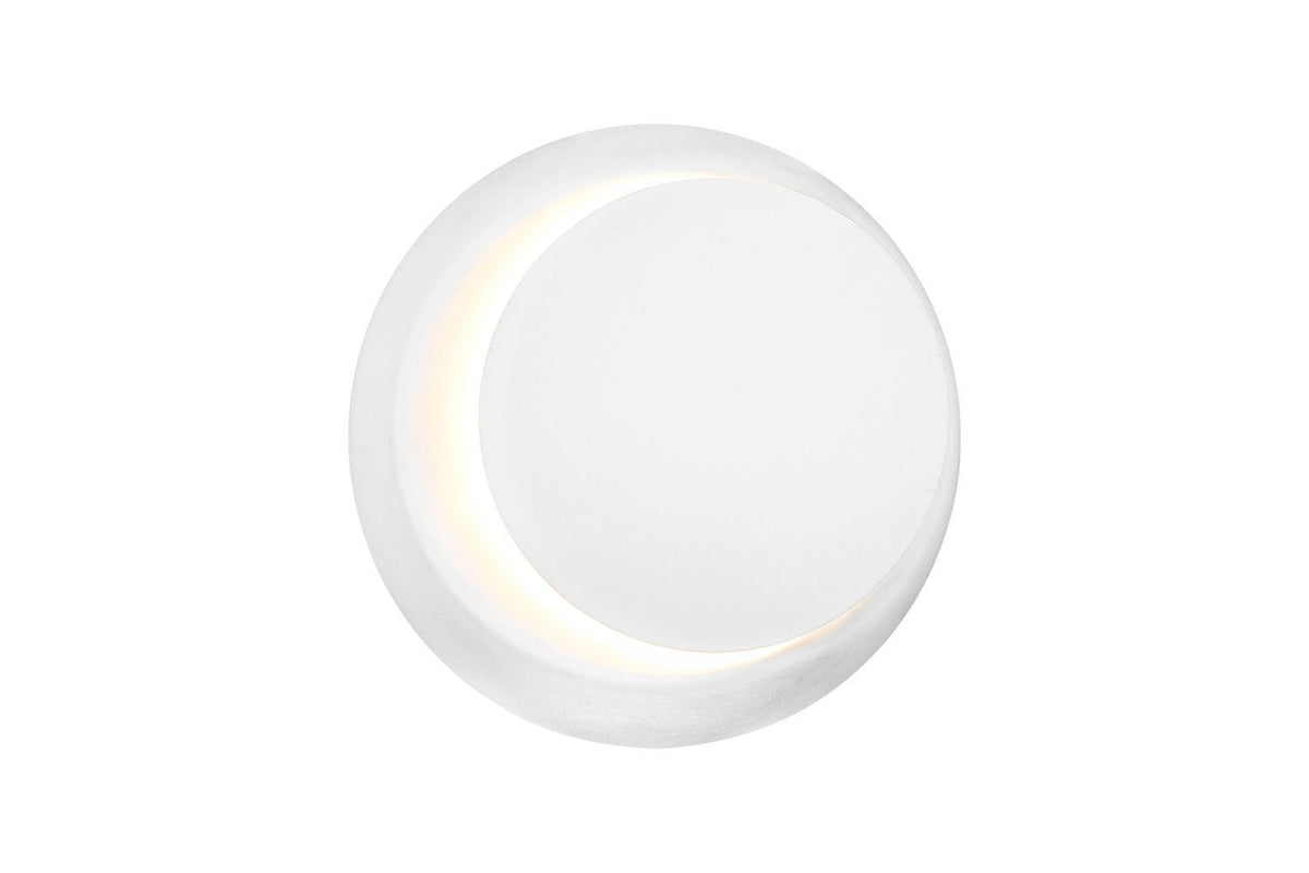 Vue de face du luminaire montrant le disque blanc et l'anneau lumineux
