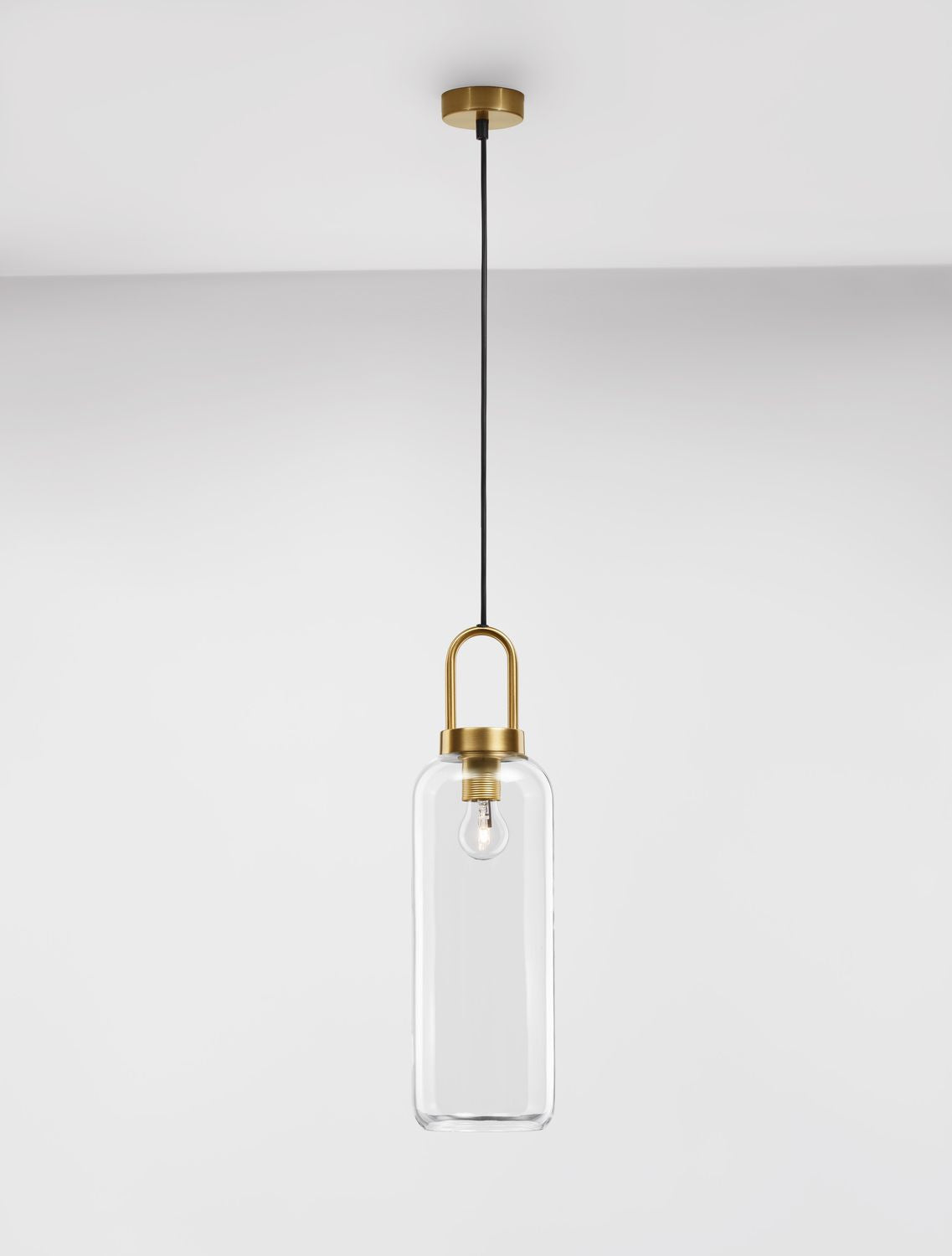 Silhouette verticale du cylindre en verre et de sa longue suspension noire