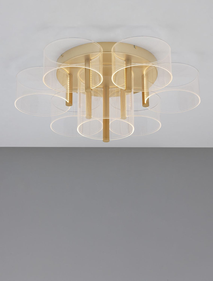 Plafonnier allumé vu de dessous, cercles lumineux soulignant chaque cylindre