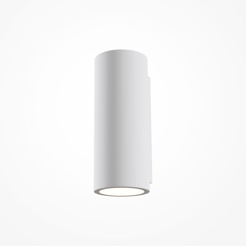 Détail du bas du luminaire montrant le diffuseur circulaire allumé et la finition lisse
