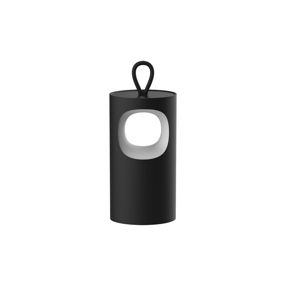 Lampe cylindrique noire mate avec poignée et ouverture lumineuse ovale, sur fond blanc.