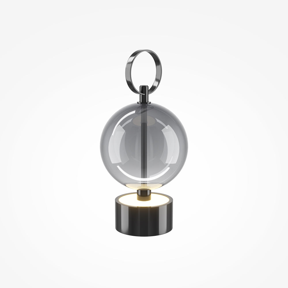 Lampe de chevet noire de face, sphère en verre sur socle cylindrique