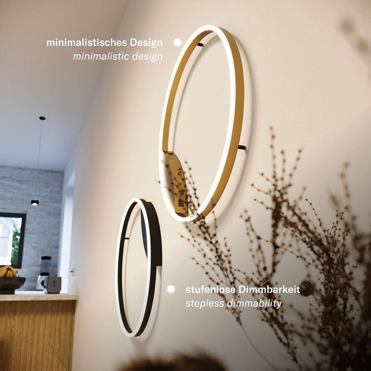 Deux luminaires annulaires doré et noir fixés au mur ambiance minimaliste