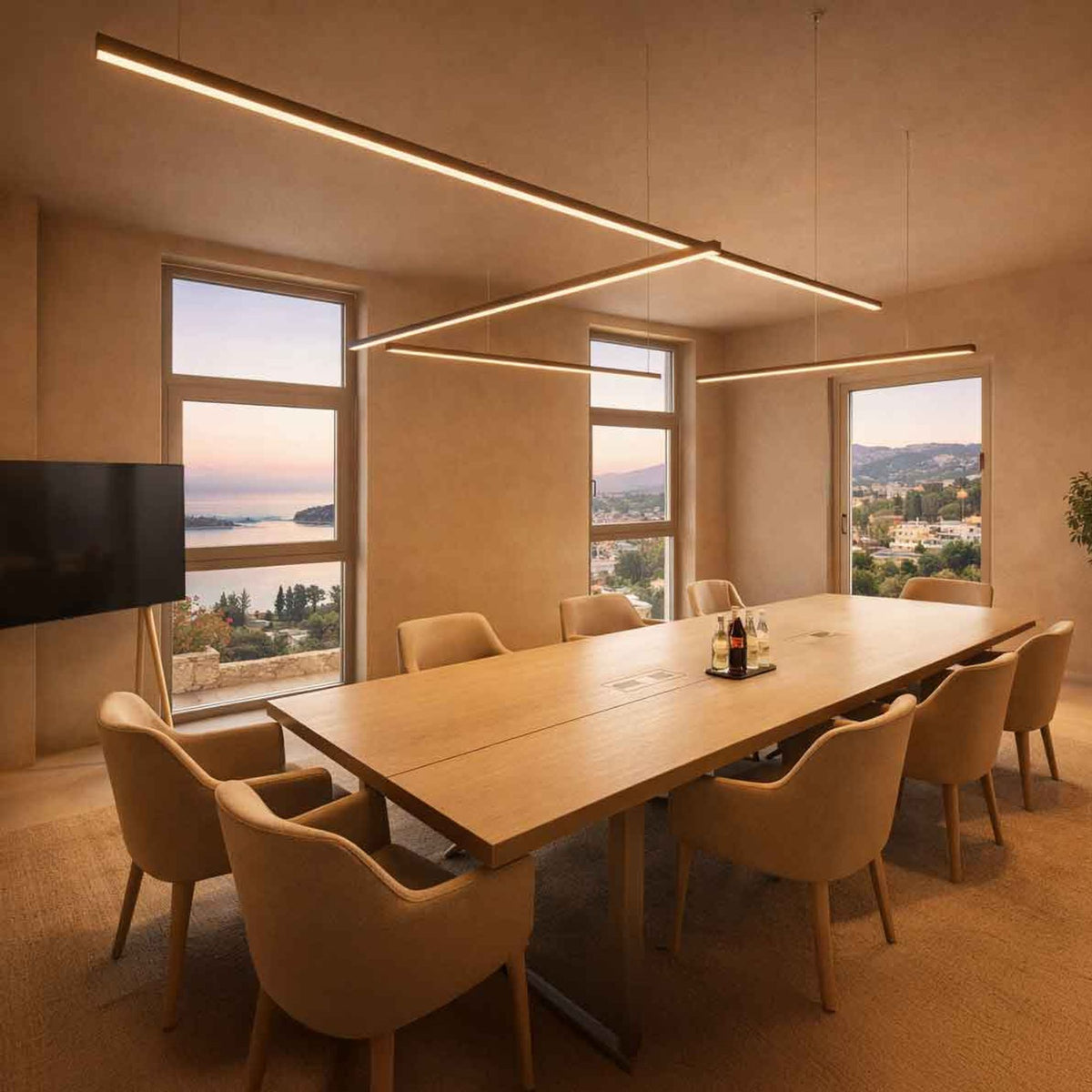 Vue d'ensemble de plusieurs suspensions linéaires croisées au-dessus d'une grande table de réunion