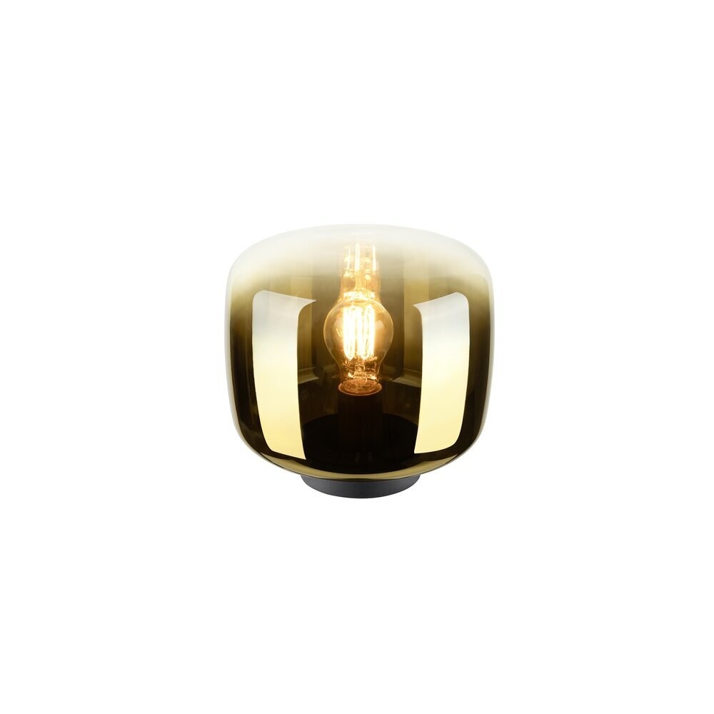 Lampe à poser dorée de face avec ampoule visible sous abat-jour en verre fumé.