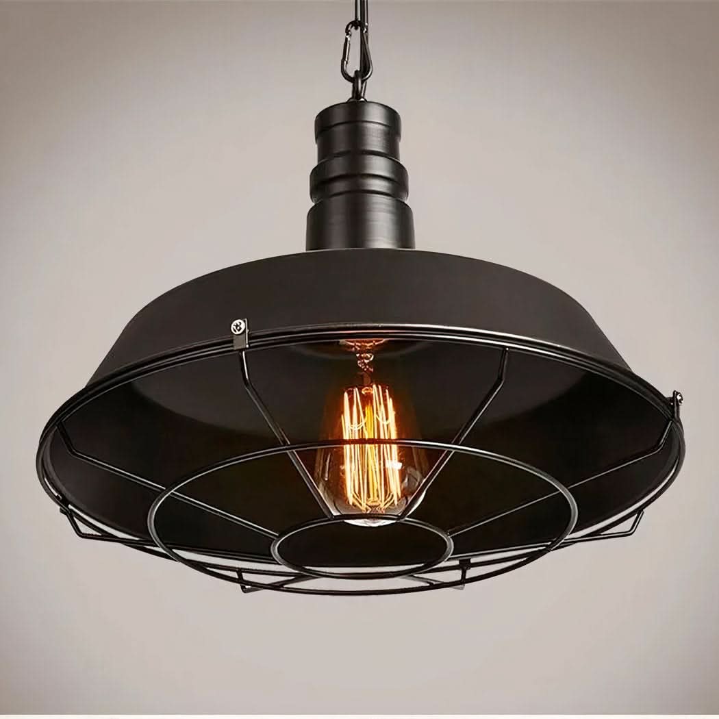 Vue de dessous du luminaire noir éclairé, ampoule à filament visible dans la cage.