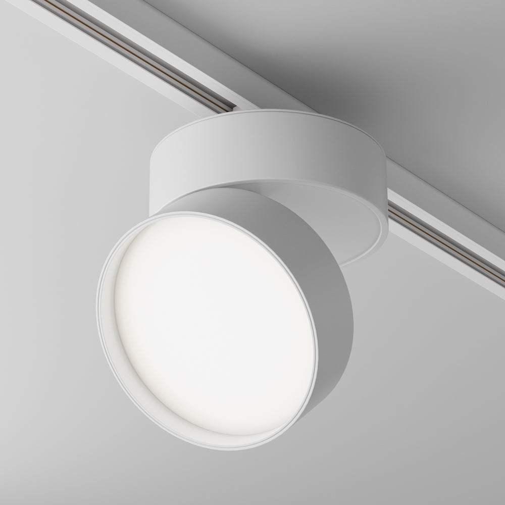 Spot blanc fixé sur un rail de plafond, vue de face avec diffuseur allumé