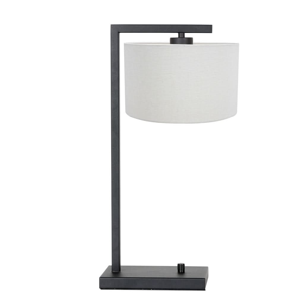 Lampe de table noire avec abat-jour cylindrique en lin blanc, de face.
