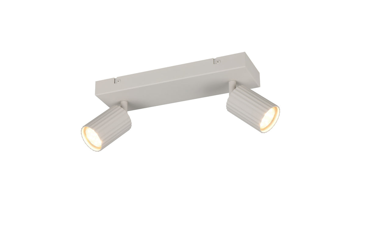 Spot de plafond blanc à deux têtes orientables, vue de trois quarts sur fond blanc