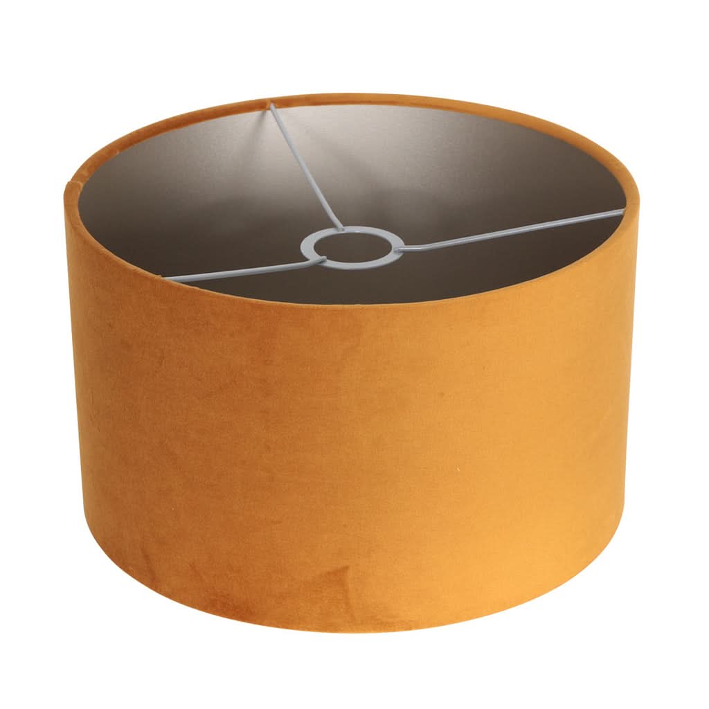Intérieur de l'abat-jour cylindrique doré avec armature métallique blanche apparente.