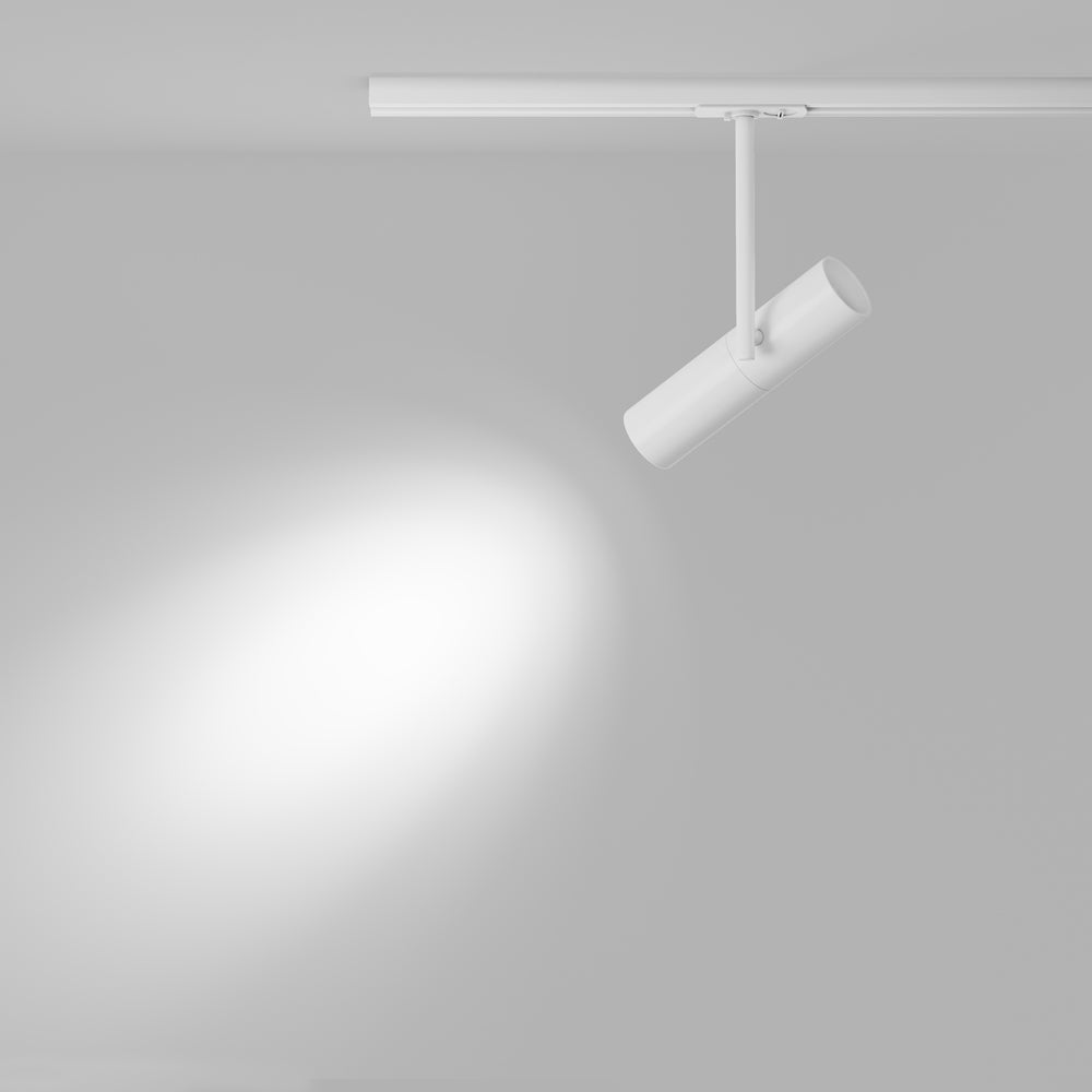 Mise en ambiance, halo lumineux diffus projeté sur un mur gris clair