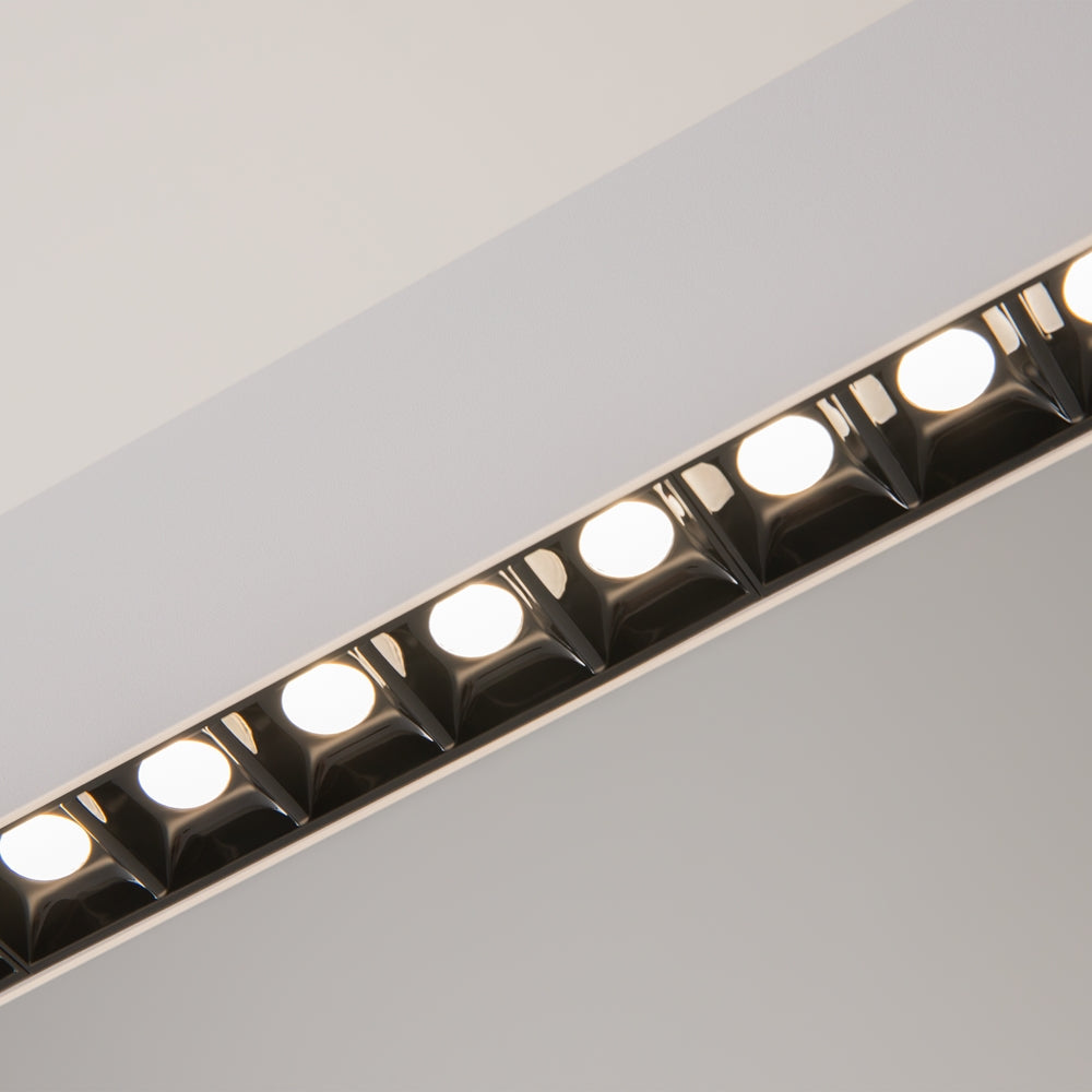 Détail rapproché des modules LED alignés dans le profil en aluminium